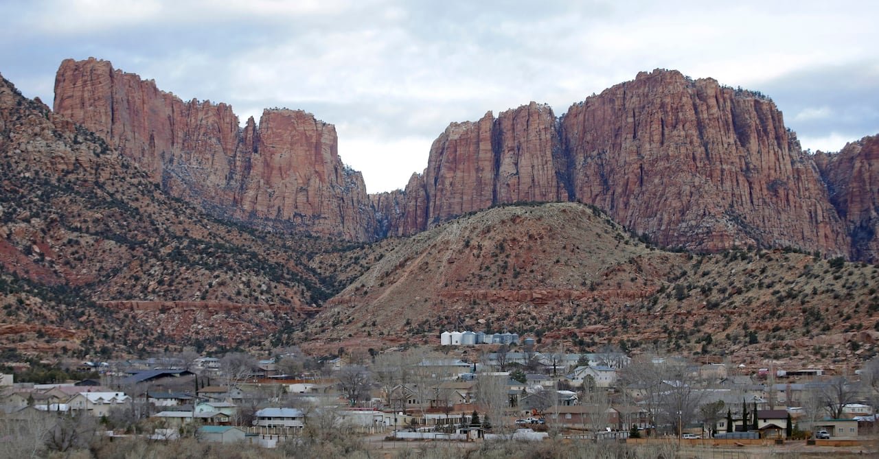A small town in the shadows of desert mountains